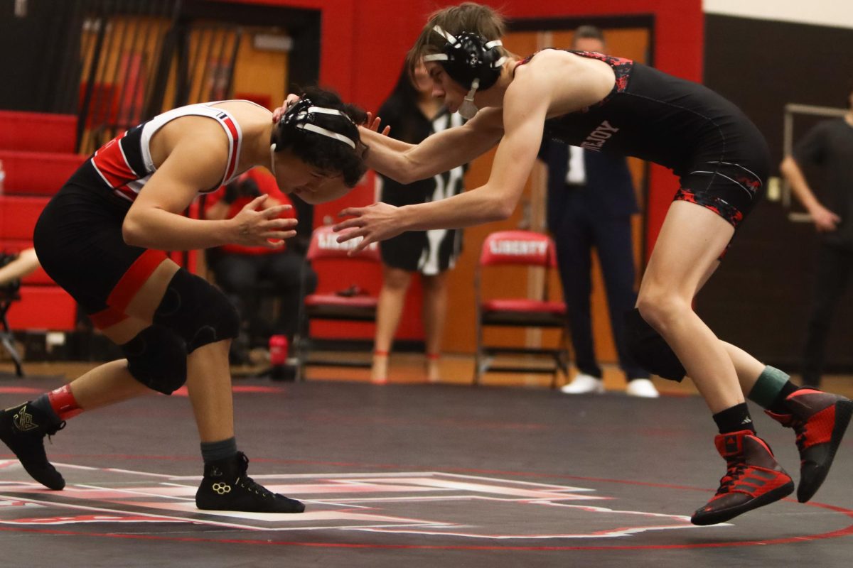 Junior Dalton Hart ties up with his opponent. The leopards beat whitehouse in the duel.