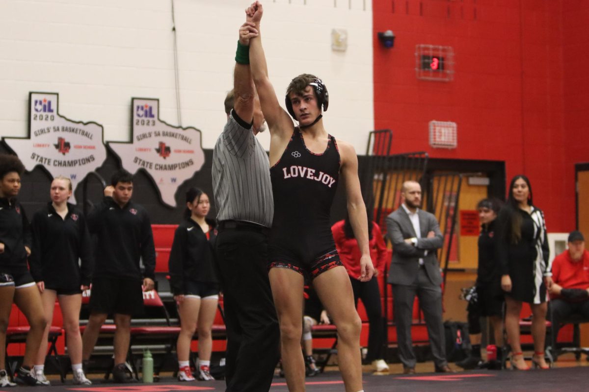 Lovejoy Wrestler stands after a match. Lovejoy defeated Frisco Lebanon Trail at the duel.  