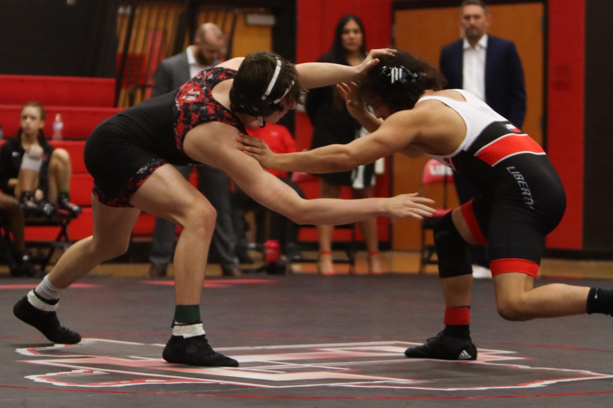 Lovejoy Wrestler hand fights with their opponent. The Wrestler won this match by points.