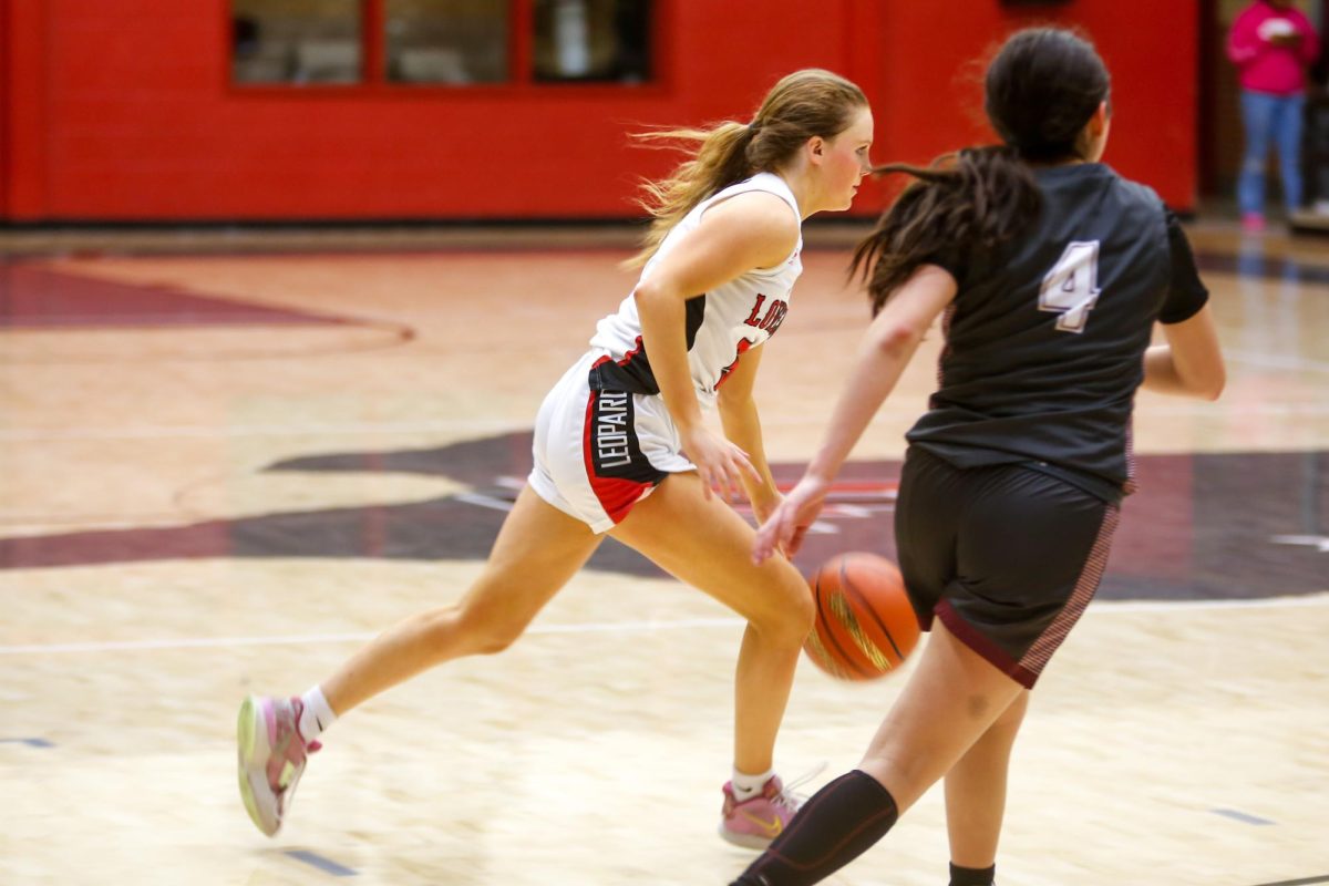 Senior guard no. 5 Brinley Ludlow runs a play. Lovejoy is fourth in the district.
