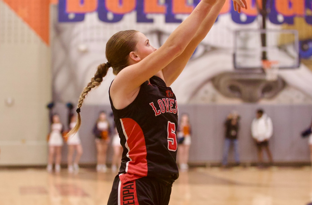 Senior no. 5 Brinley Ludlow shoots the ball. She made the bucket for three points.