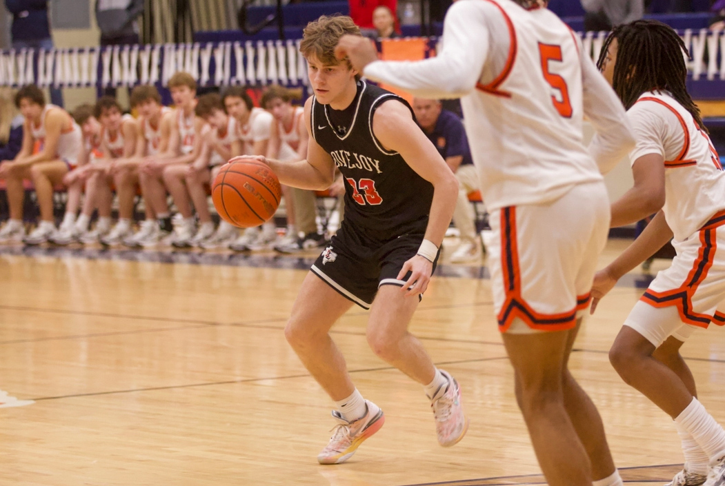 Junior no. 23 Luke Lytle dribbles the ball. The game was against McKinney North.