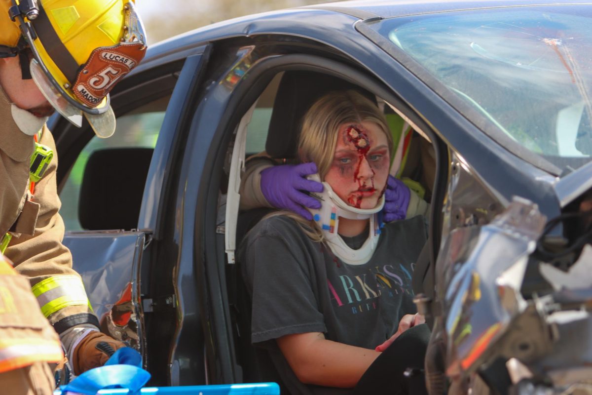 Senior madilon smith sits in the car after the accident.Fire and police officials arrive at the mock crash outside the school, and some students are transported via air and ground emergency medical services to the JPS emergency department, where they experience a full trauma resuscitation and realistic follow-up care. 