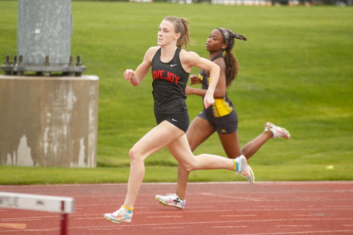 Junior Mia Reaugh runs the girls varsity 400m dash. Reaugh got first with a time of 58.86.