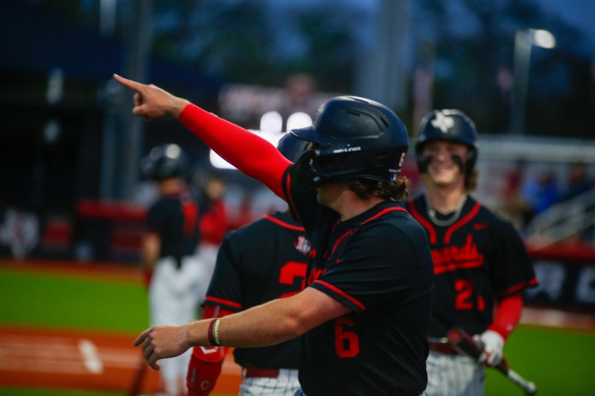 Junior third baseman no. 6 Asher Lacy points in celebration after scoring. Lovejoy is ranked 33rd in their division.