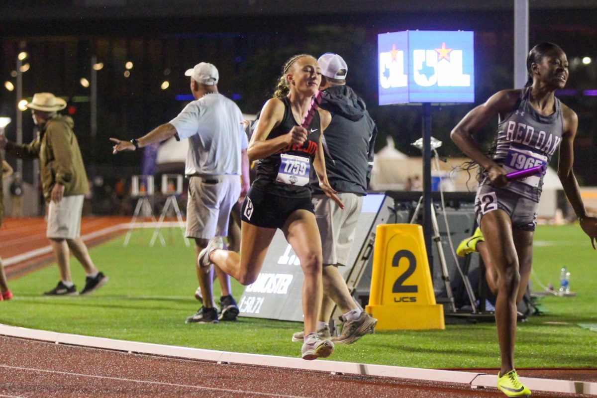 Sophomore Cailee Horinek runs the third leg of the 4x400 meter race.  Horinek passed the Red Oak girl.  