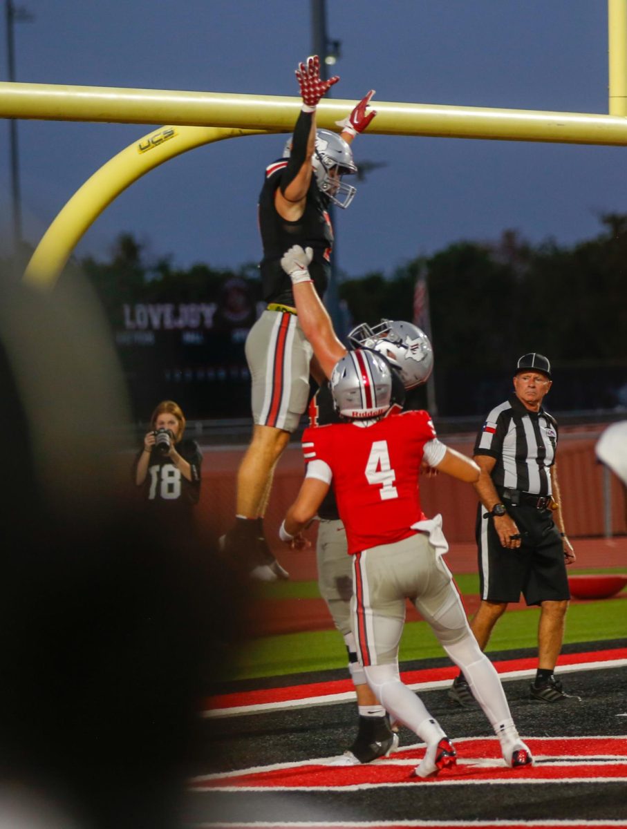 Senior guard no. 54 Braedon Gibson lifts Senior Running back no. 7 Ben Adams after a touchdown. The next game is  against Lubbock Cooper High School