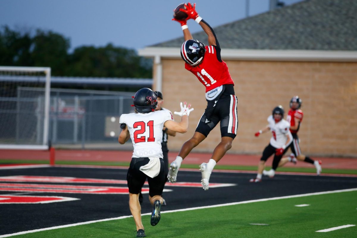 Senior Wide receiver no. 11 Daylan McCutcheon catches a pass. Lovejoy played against Liberty this past Friday.