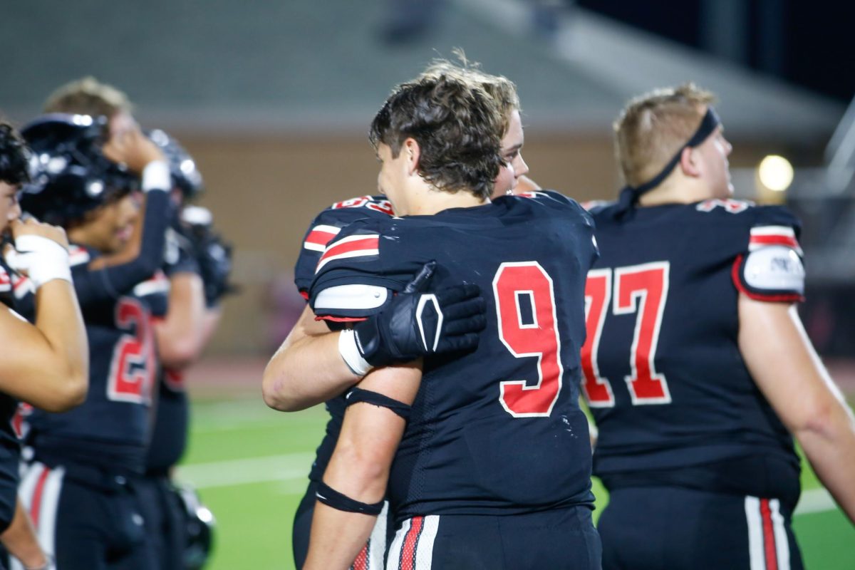 Senior Gavin Prince hugs senior Carsten Dunn celebrate the win. Lovejoy is ranked second in district.