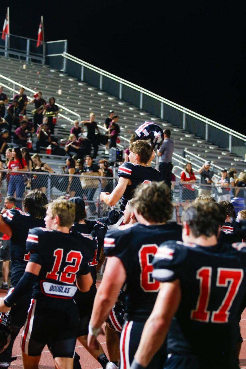 Lovejoy players hoist junior kicker no. 31 Cooper Ryan on their shoulders after his game winning field goal. Lovejoy is 3-2 overall.