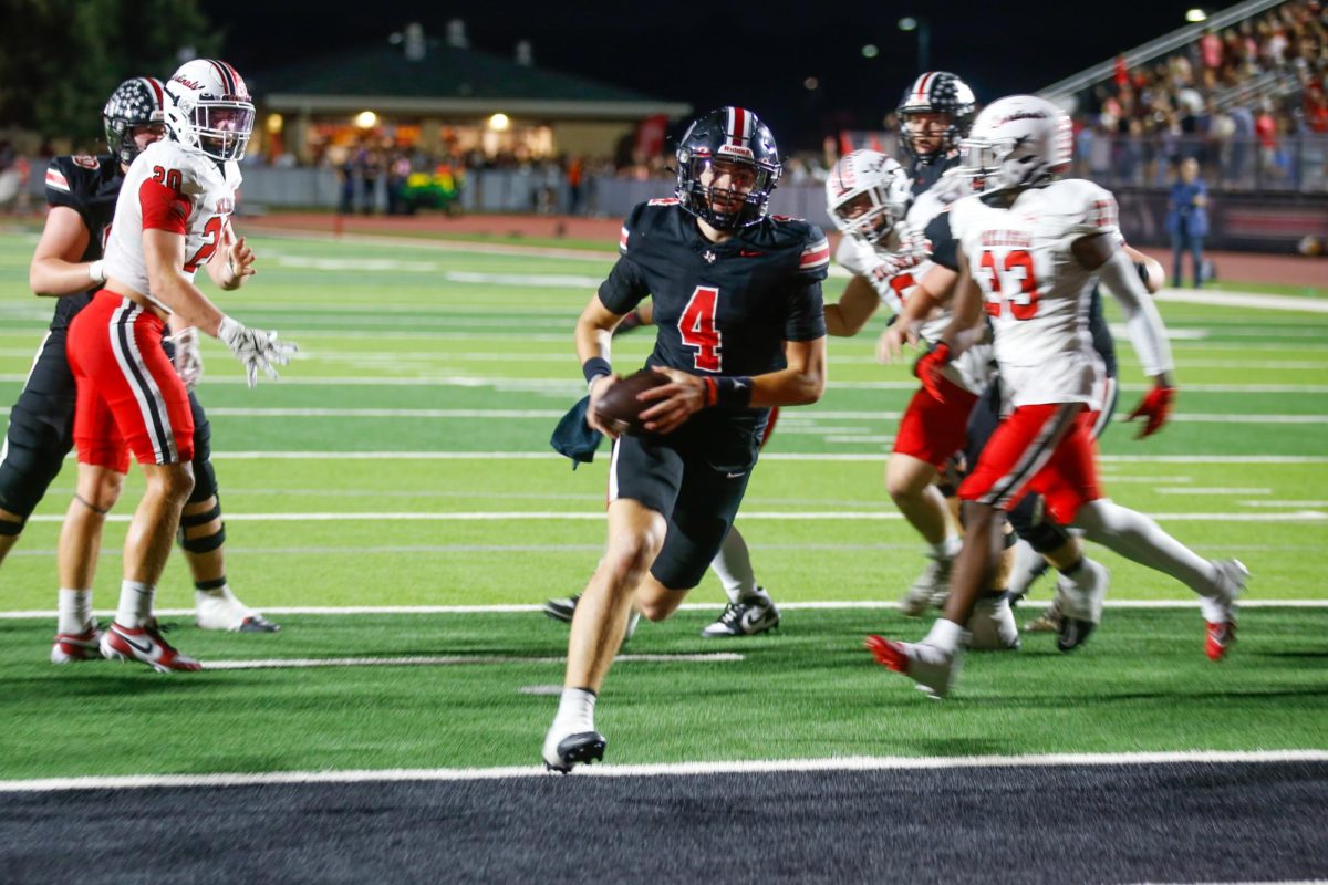 Junior quarterback no. 4 Jacob Janecek scores a touchdown. Lovejoy won 41-38.