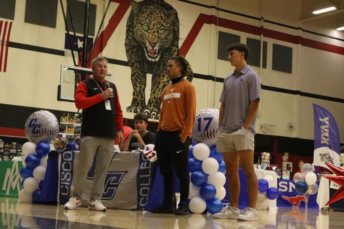 Seniors RJ McIntosh and Daylan McCutcheon are recognized by boys head football coach Todd Dodge. McCutcheon signed with the University of Texas at Austin, and McIntosh signed with the University of Tulsa.