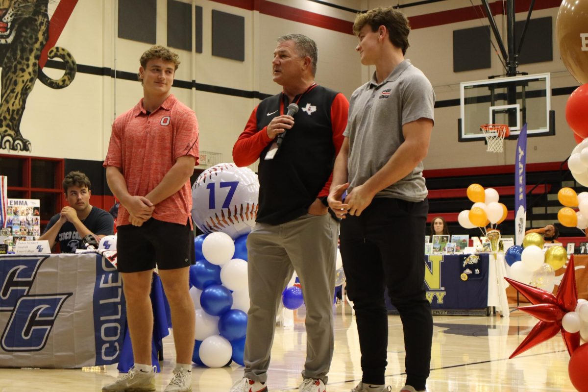 Seniors Kevin and Owen Magee are recognized by boys head football coach Todd Dodge. The Magee twins are committed to The Ohio State University to play lacrosse.