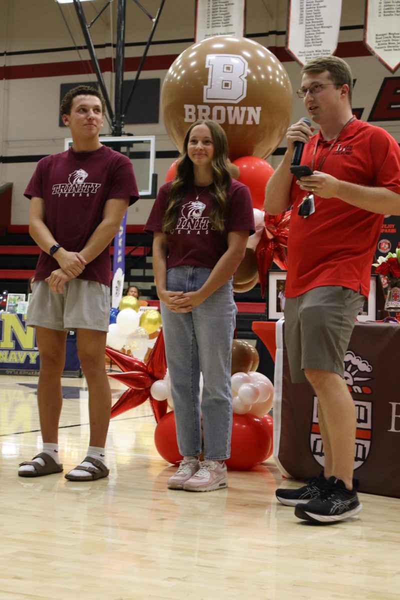 Twins Sean and Ava Easley are recognized by their swim coach. Both Sean and Ava signed to swim at Trinity University.