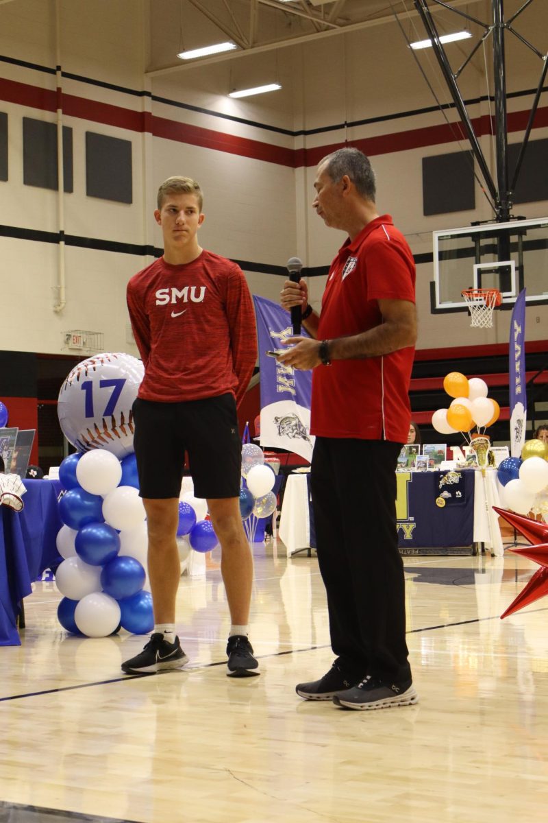 Senior Nathan Kinser is recognized by boys varsity soccer coach Pablo Duran. Nathan signed with Southern Methodist University to play soccer.