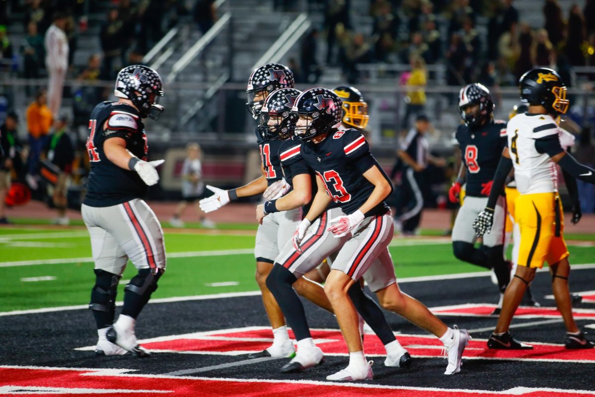 The Lovejoy football team runs off the field after a touchdown. Lovejoy played against Denison High School this past Friday.