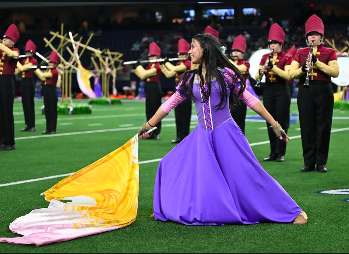 The band's theme this year was "Locked Away," inspired by the story of Rapunzel. The Color Guard wore costumes that echoed Rapunzel's appearance and twirled flags designed to represent her long, flowing blonde hair.