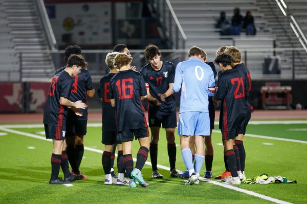 The team meets in a huddle before the start of the second half. The 2025 team captains are Senior goalkeeper no. 0 Nathan Kinser, and Senior defender no. 17 Zach Heuttner.