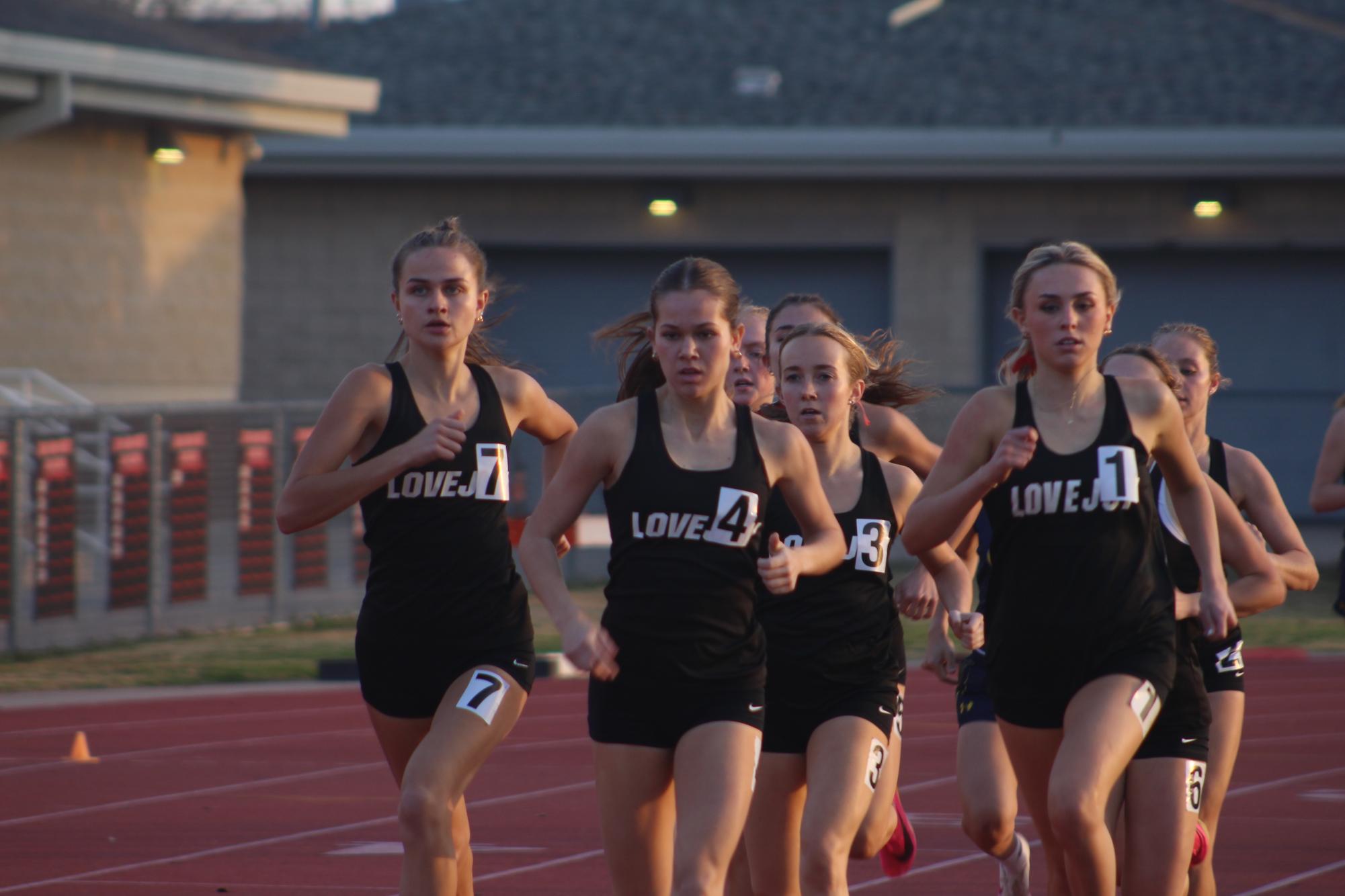 A pack of Lovejoy girls run the 800m. Lovejoy got 1st, 3rd, 4th, and 6th.