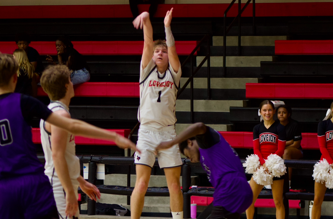 Senior guard no. 1 Tate Ziemkiewicz shoots a three-pointer. Lovejoy played against Anna High School.