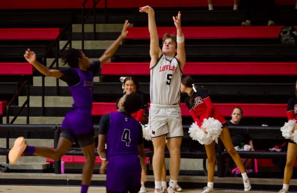 Senior shooting guard no. 5 Luke Lytle shoots a three-pointer. Lovejoy is ranked first in the district.