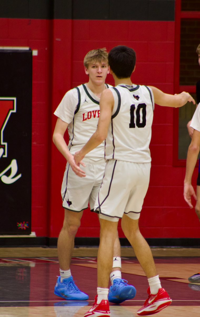 Seniors Tate Ziemkiewicz and Pierce Patel celebrate after Ziemkiewicz made a shot. Lovejoy is 26-5 overall.