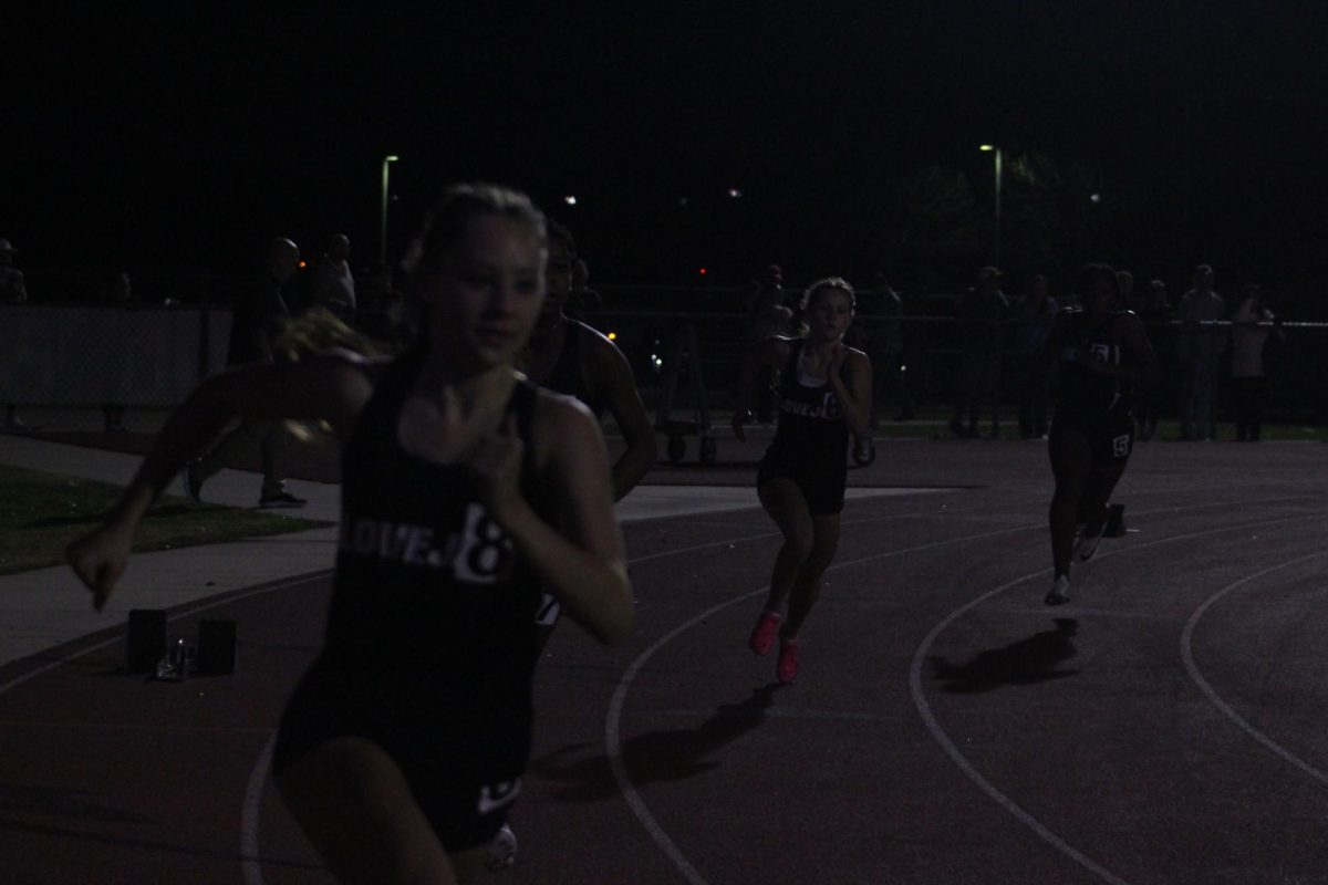 Juniors Camryn Benson and Harper Jaynes run the 400m. Both girls are members of the cross country team.