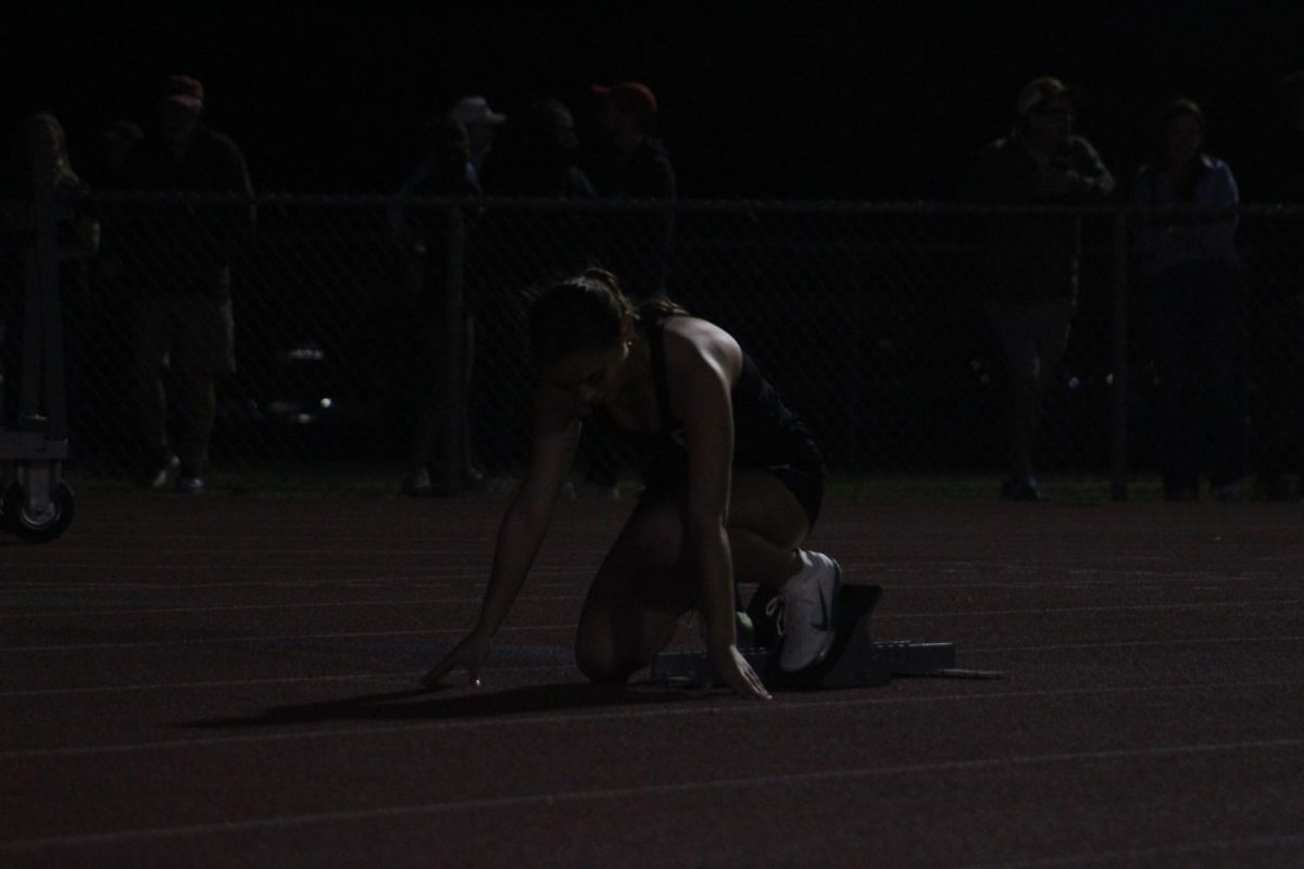 Sophomore Jocelyn Schuler prepares to run. This meet was the first of the season.